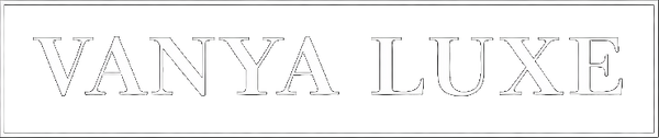 White 'VANYA LUXE' logo on a black background